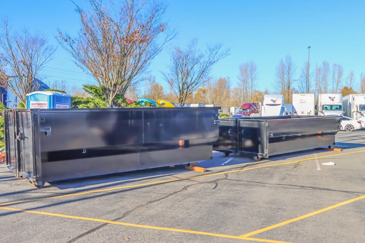 Professional dumpster rental service with roll-off container on residential driveway in Lincolnton